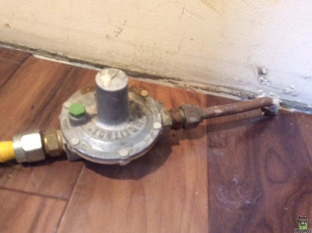 Image for New range/oven installation - old, big gas pressure regulator sticking out of floor - unnecessary, redundant?