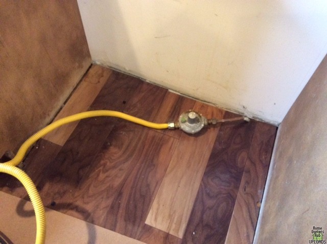 Image for New range/oven installation - old, big gas pressure regulator sticking out of floor - unnecessary, redundant?