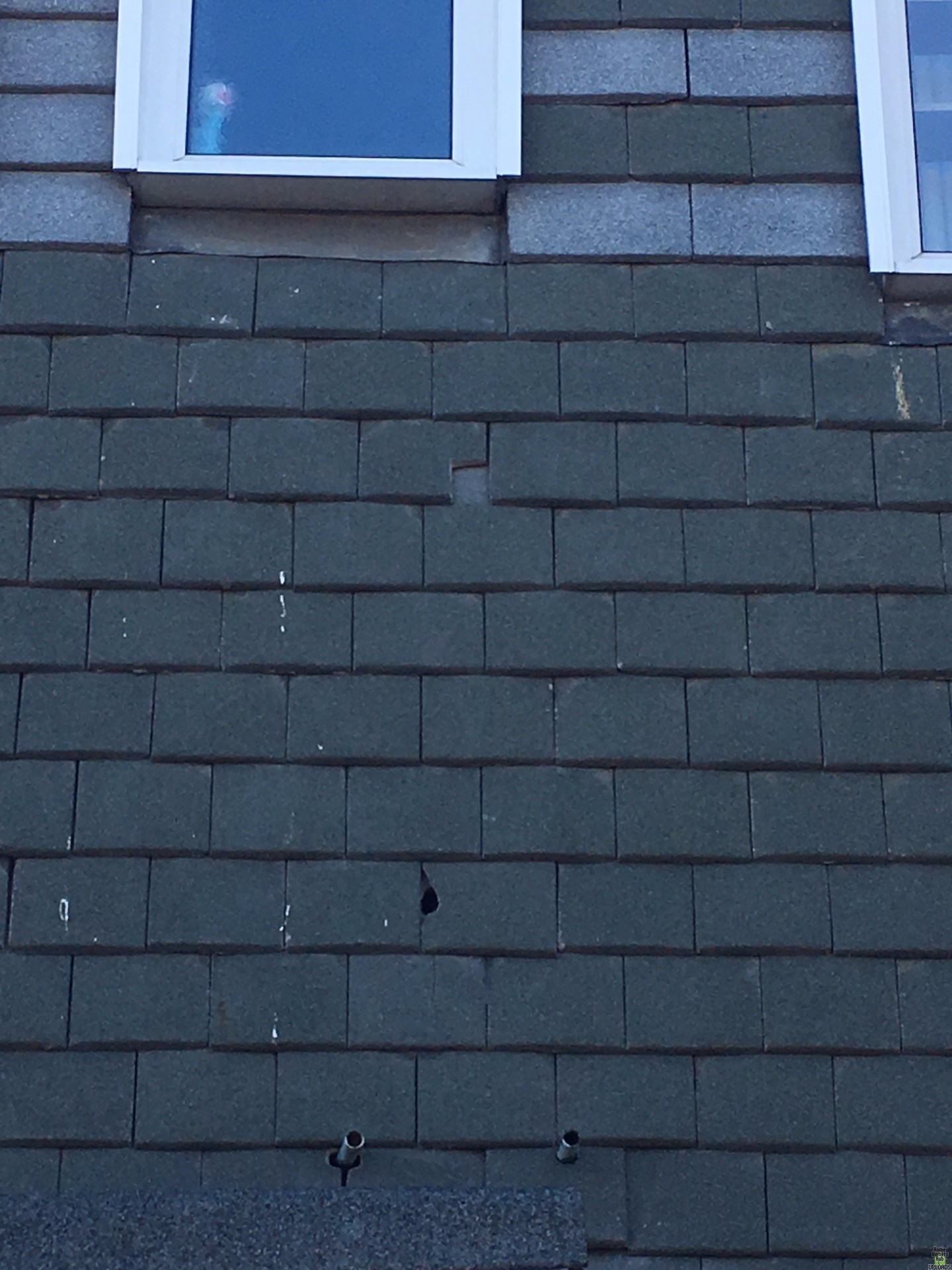 Image for Replacing broken tiles on front of house