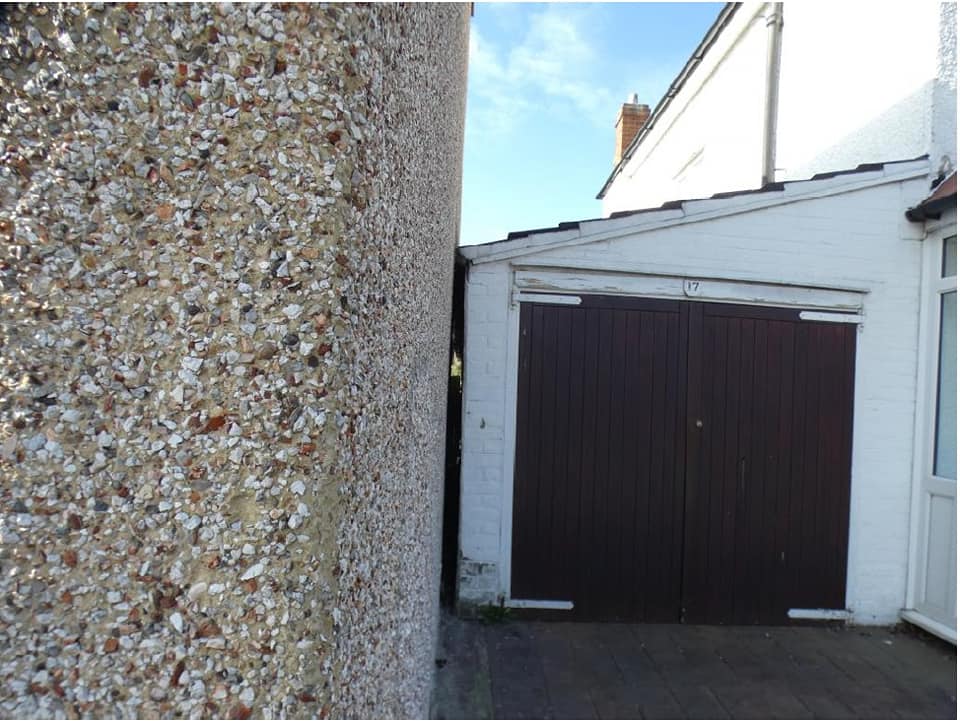 Image for Damp due to neighbour's garage being sloped and driveway raised.